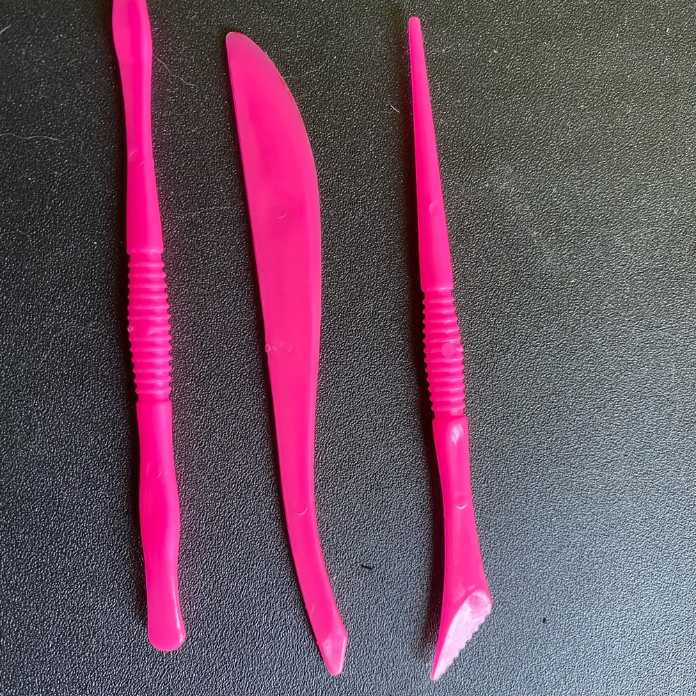 Small pink clay cutters. Used.